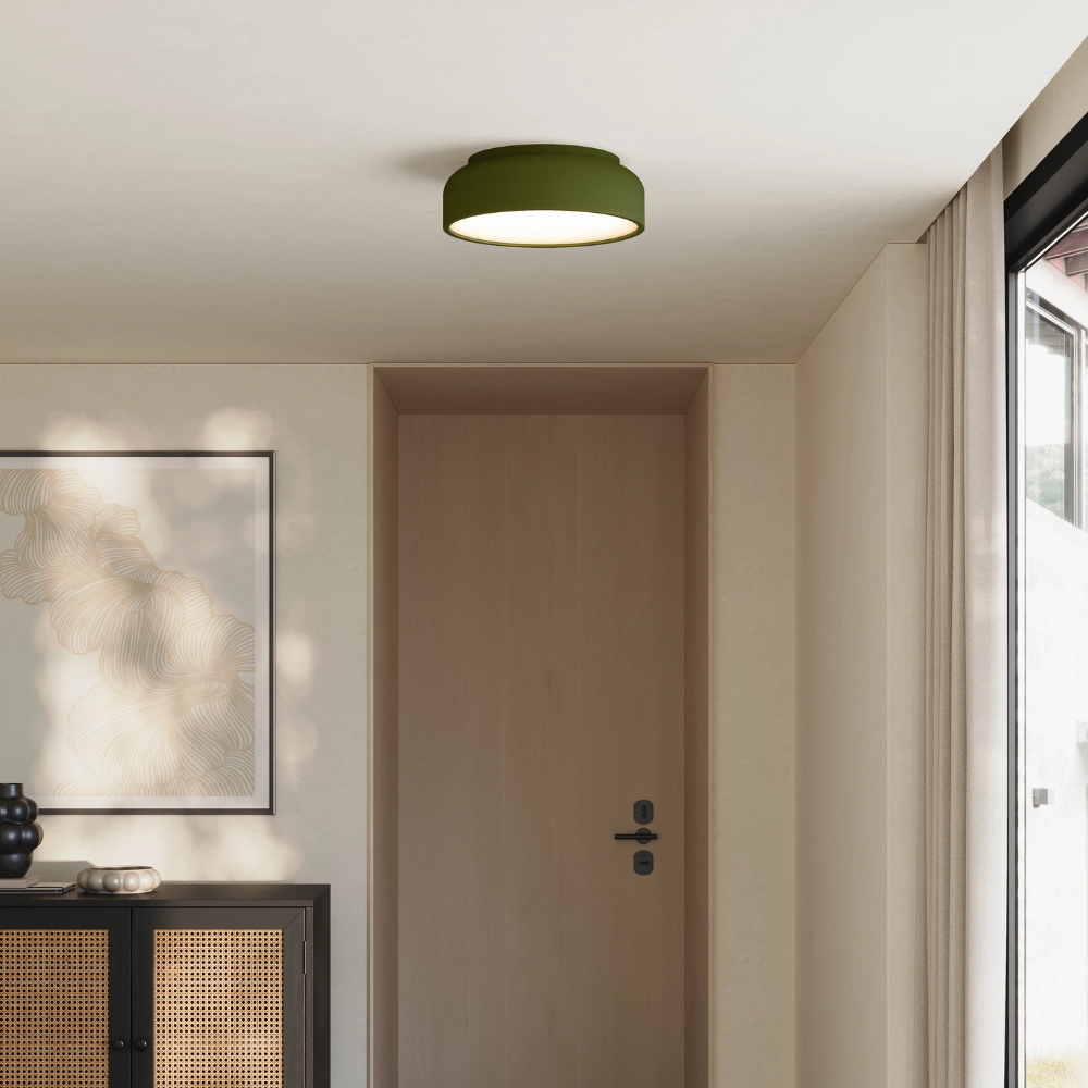 The olive Vitria Flush Mount from Gantri in a living room on the ceiling.