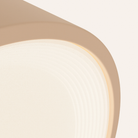 The peach Vitria Flush Mount from Gantri close up.