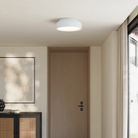 The snow Vitria Flush Mount from Gantri in a living room on the ceiling.