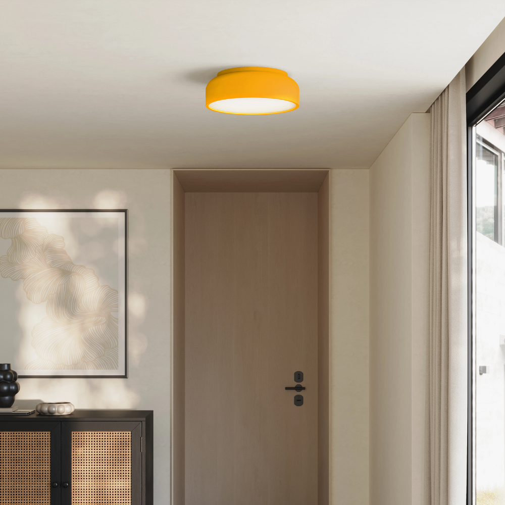 The sunrise Vitria Flush Mount from Gantri in a living room on the ceiling.