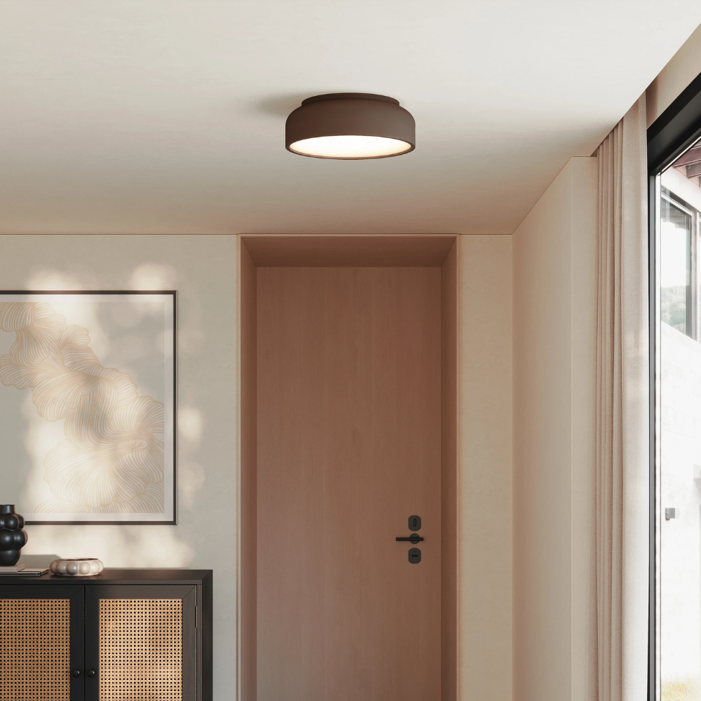 The walnut Vitria Flush Mount from Gantri in a living room on the ceiling.