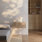 The Word Table Light from Gantri in a primary bedroom.