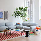 Three of the Cyclade Tables from Herman Miller within a lounge area.