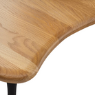 The Cyclade Table from Herman Miller in low, without a bowl, with a close-up of the table.