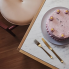 The oak Doubleframe Table from Herman Miller in a dining setting.