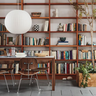 The walnut Doubleframe Table from Herman Miller in a home office.