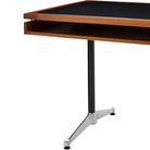 The walnut Eames 2500 Series Executive Desk from Herman Miller with leather inlay finish base.