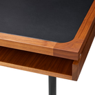 The walnut Eames 2500 Series Executive Desk from Herman Miller with leather inlay finish focusing on the corner.