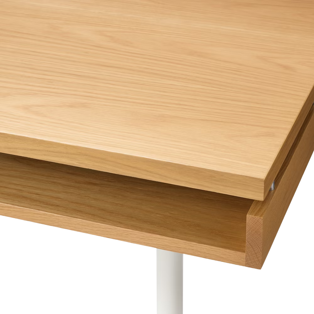 The white oak Eames 2500 Series Executive Desk from Herman Miller close up.