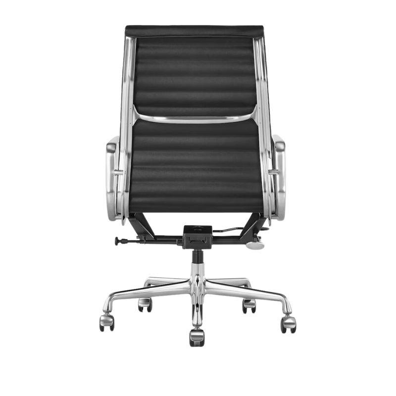The Eames Aluminum Group Chair, Executive from Herman Miller with the black leather, aluminum frame and standard height in a photograph of the back.