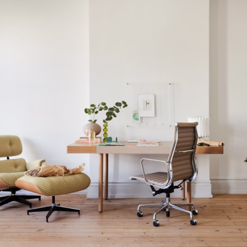The Eames Aluminum Group Chair, Executive from Herman Miller in a living room.