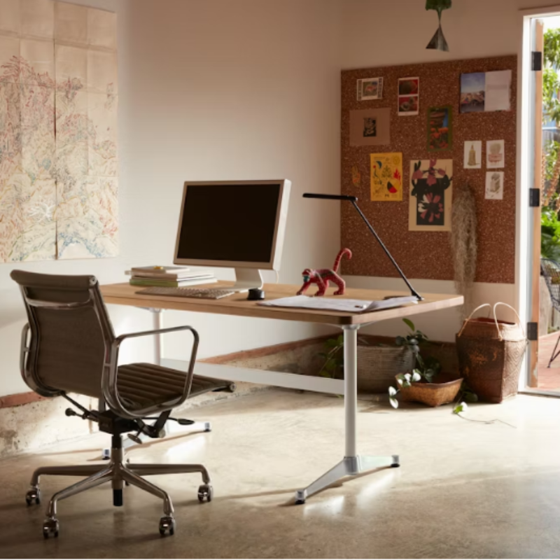 The Eames Aluminum Group Chair, Management from Herman Miller in a home office.