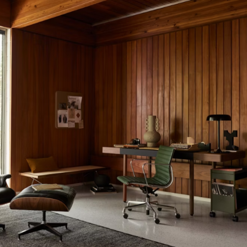 The Eames Aluminum Group Chair, Management from Herman Miller in a office.