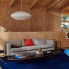 The black Eames Elliptical Table from Herman Miller in a living room. all-groups