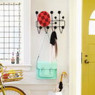 The Eames Hang-It-All from Herman Miller next to a doorway.