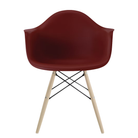 The brick red shell Eames Molded Plastic Armchair Dowel-Leg Base with the black base and white oak legs.
