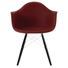 The brick red shell Eames Molded Plastic Armchair Dowel-Leg Base with the white base and ebony legs.