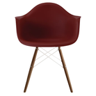 The brick red shell Eames Molded Plastic Armchair Dowel-Leg Base with the white base and walnut legs.