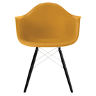The deep yellow shell Eames Molded Plastic Armchair Dowel-Leg Base with the white base and ebony legs.