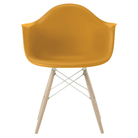 The deep yellow shell Eames Molded Plastic Armchair Dowel-Leg Base with the white base and white oak legs.