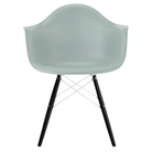 The gray green shell Eames Molded Plastic Armchair Dowel-Leg Base with the white base and ebony legs.