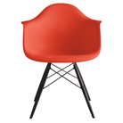 The red orange shell Eames Molded Plastic Armchair Dowel-Leg Base with the black base and ebony legs.
