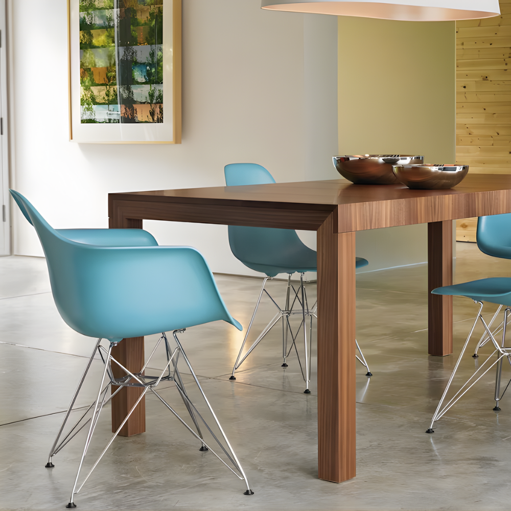 The pale blue shell Eames Molded Plastic Armchair Wire Base from Herman Miller in a family area.