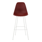 The brick red shell Eames Molded Plastic Bar Height Stool from Herman Miller with the white base.