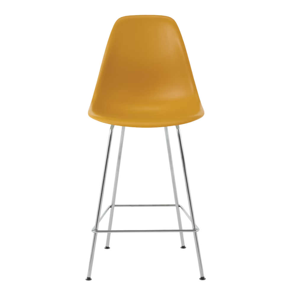 The deep yellow shell Eames Molded Plastic Counter Height Stool from Herman Miller with the trivalent chrome base.