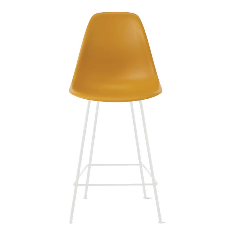 The deep yellow shell Eames Molded Plastic Counter Height Stool from Herman Miller with the white base.