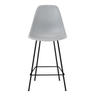 The light gray shell Eames Molded Plastic Counter Height Stool from Herman Miller with the black base.