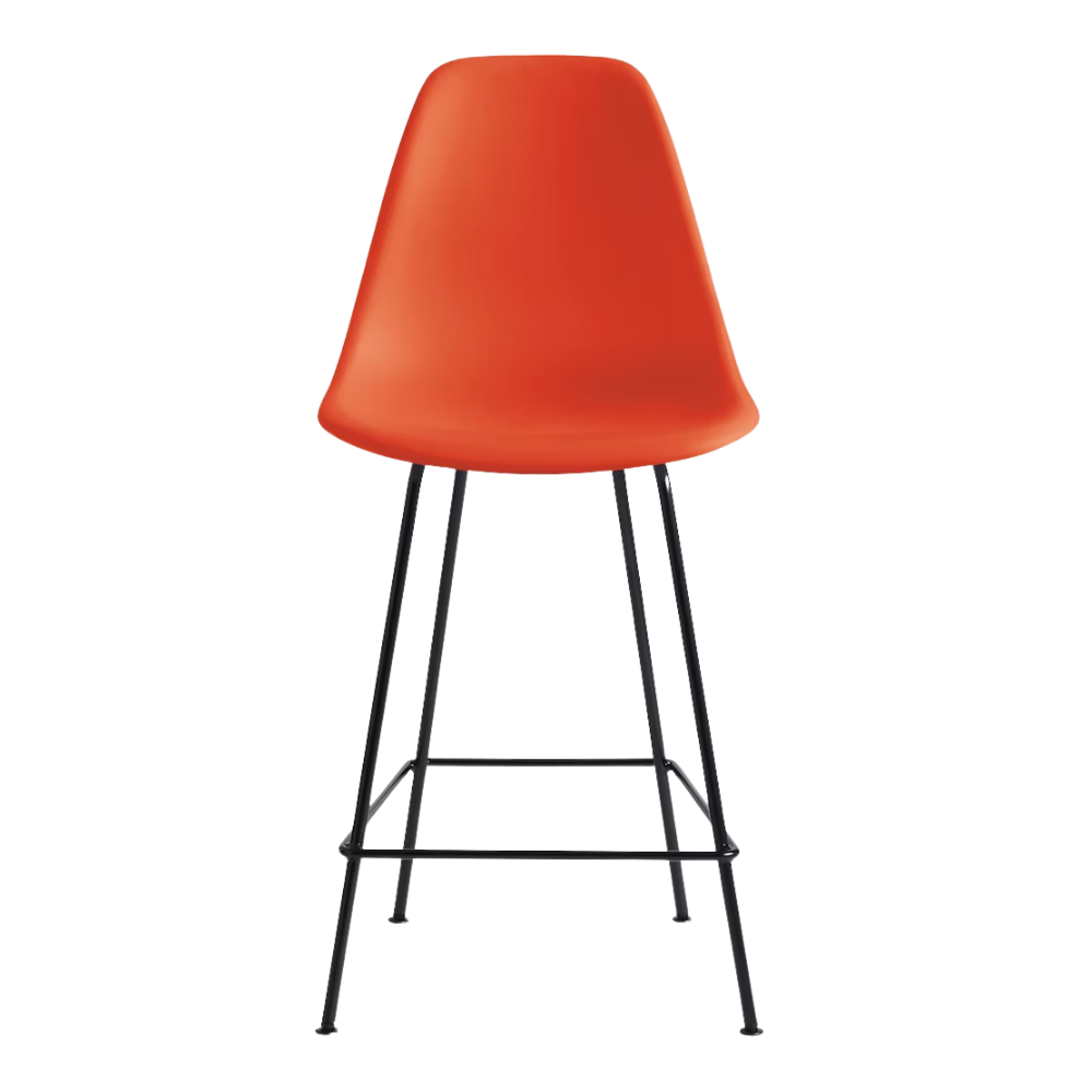 The red orange shell Eames Molded Plastic Counter Height Stool from Herman Miller with the black base.