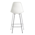 The white shell Eames Molded Plastic Counter Height Stool from Herman Miller with the trivalent chrome base from the back.