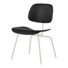 The Eames Molded Plastic Dining Chair from Herman Miller with the black shell and white leg finish.