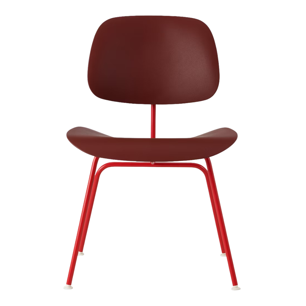 The Eames Molded Plastic Dining Chair from Herman Miller with the brick red shell and blaze leg finish from the front.
