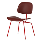 The Eames Molded Plastic Dining Chair from Herman Miller with the brick red shell and blaze leg finish.