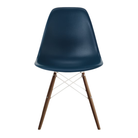 The blue green shell Eames Molded Plastic Side Chair Dowel-Leg Base from Herman Miller with the white base and walnut legs.