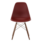 The brick red shell Eames Molded Plastic Side Chair Dowel-Leg Base from Herman Miller with the trivalent chrome base and walnut legs.