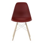The brick red shell Eames Molded Plastic Side Chair Dowel-Leg Base from Herman Miller with the white base and white oak legs.