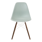 The gray green shell Eames Molded Plastic Side Chair Dowel-Leg Base from Herman Miller with the white base and walnut legs.