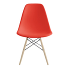 The red orange shell Eames Molded Plastic Side Chair Dowel-Leg Base from Herman Miller with the black base and white oak legs.