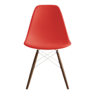 The red orange shell Eames Molded Plastic Side Chair Dowel-Leg Base from Herman Miller with the white base and walnut legs.
