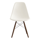 The white shell Eames Molded Plastic Side Chair Dowel-Leg Base from Herman Miller with the trivalent chrome base and walnut legs.
