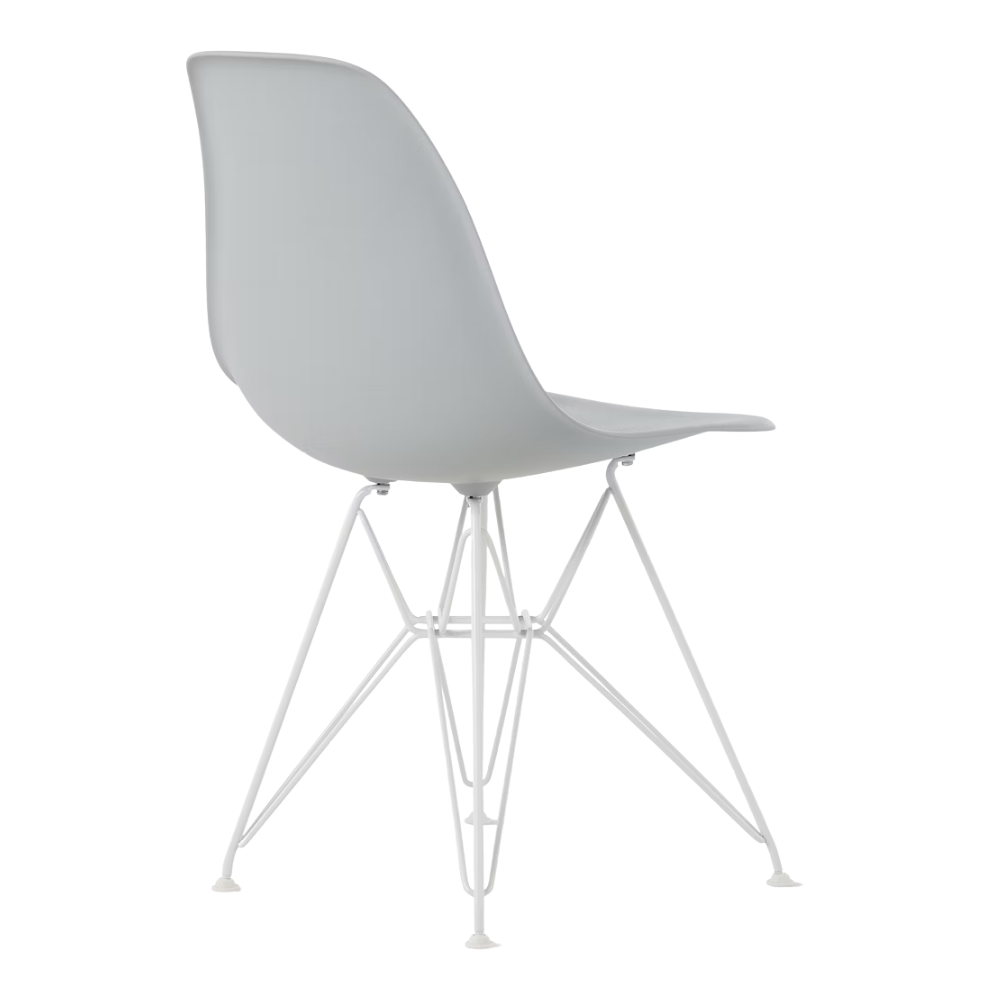 The light gray shell Eames Molded Plastic Side Chair Wire Base from Herman Miller with white base from a back angle.