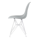 The light gray shell Eames Molded Plastic Side Chair Wire Base from Herman Miller with white base from the side.