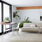 The white shell Eames Molded Plastic Side Chair Wire Base from Herman Miller in a living room.