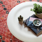The Eames Molded Plywood Coffee Table Metal Base from Herman Miller in a family area. all-groups