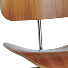 The Eames Molded Plywood Dining Chair Metal Base from Herman Miller with the santos palisander shell and trivalent chrome legs close up.