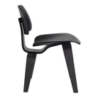 The ebony Eames Molded Plywood Dining Chair Wood Base from Herman Miller from the side.
