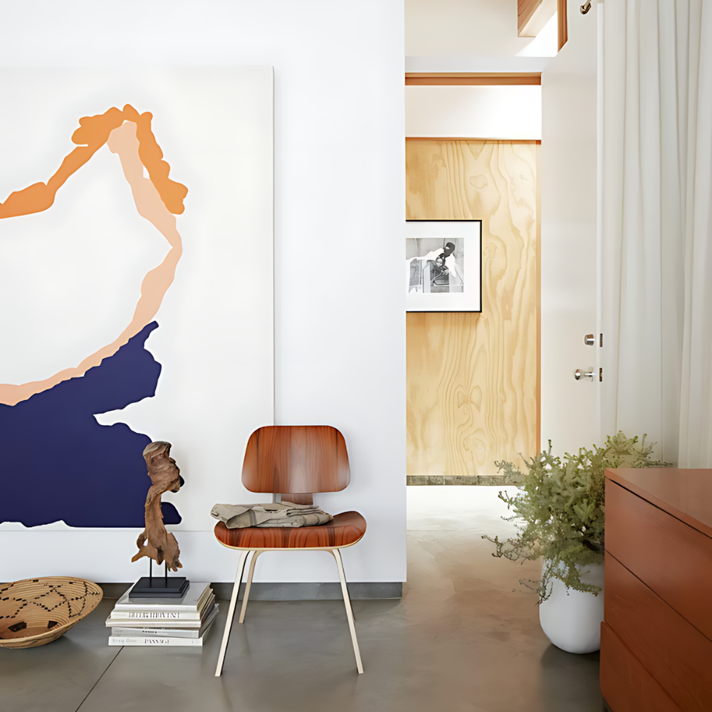 The santos palisander Eames Molded Plywood Dining Chair Wood Base from Herman Miller in a living room.